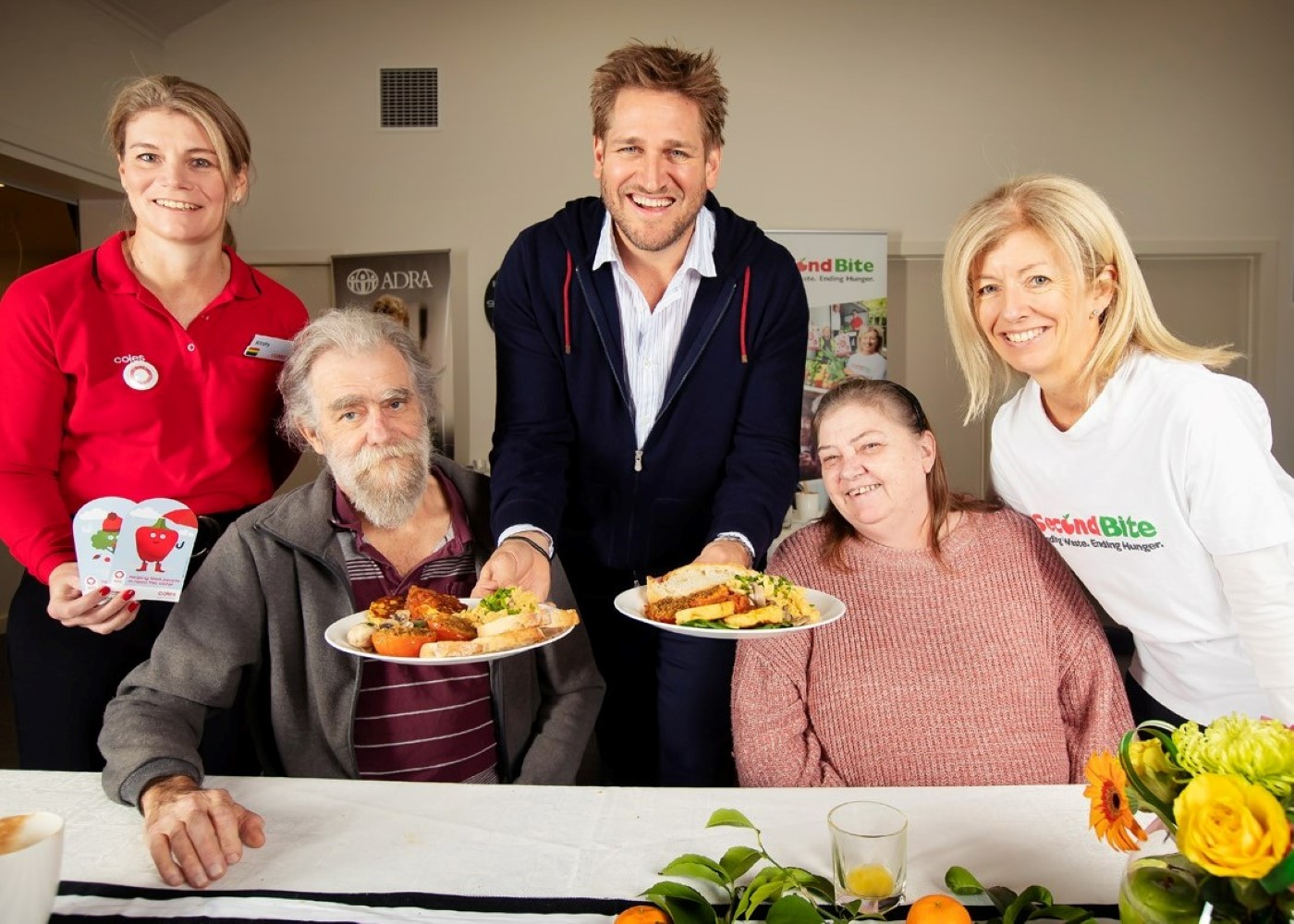L to R Kirsty Davis (Coles GM Sustainability and Property Services) Curtis Stone and Simone Carson (SecondBite co-founder) with Geoff and Perri from ADRA